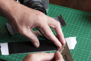 Triming-excess-double-sided-tape-for-new-camera-skins-for-a-Praktica-MTL-3-film-camera Triming excess double sided tape for new camera skins for a Praktica MTL 3 film camera