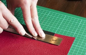 Using-old-cover-as-a-template-to-cut-arround-replacment-camera-leather Using old cover as a template to cut arround replacment camera leather